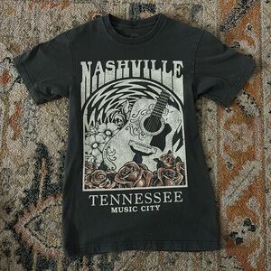 Light black graphic tee size small but fits like small/medium